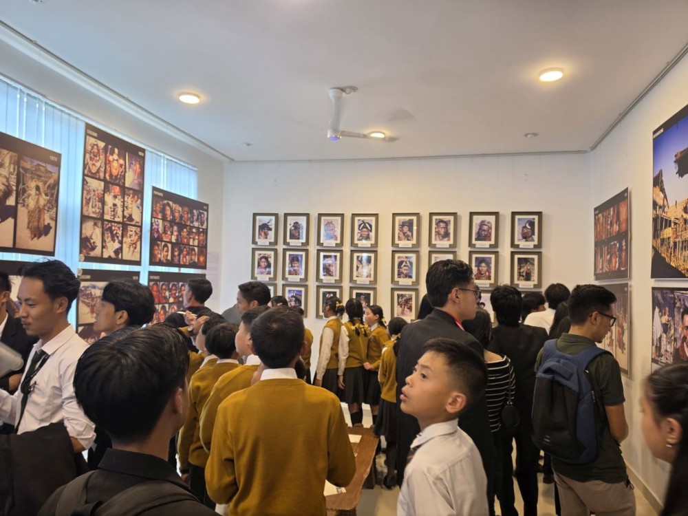 Visitors view selected photographs by Japanese ethnographic photographer, travel writer and ethnologist Yuzo Morita at the ‘Time Travel to Nagaland 1979’ photo exhibition inaugurated at the Directorate of Art & Culture, Kohima on September 12. (Morung Photo)